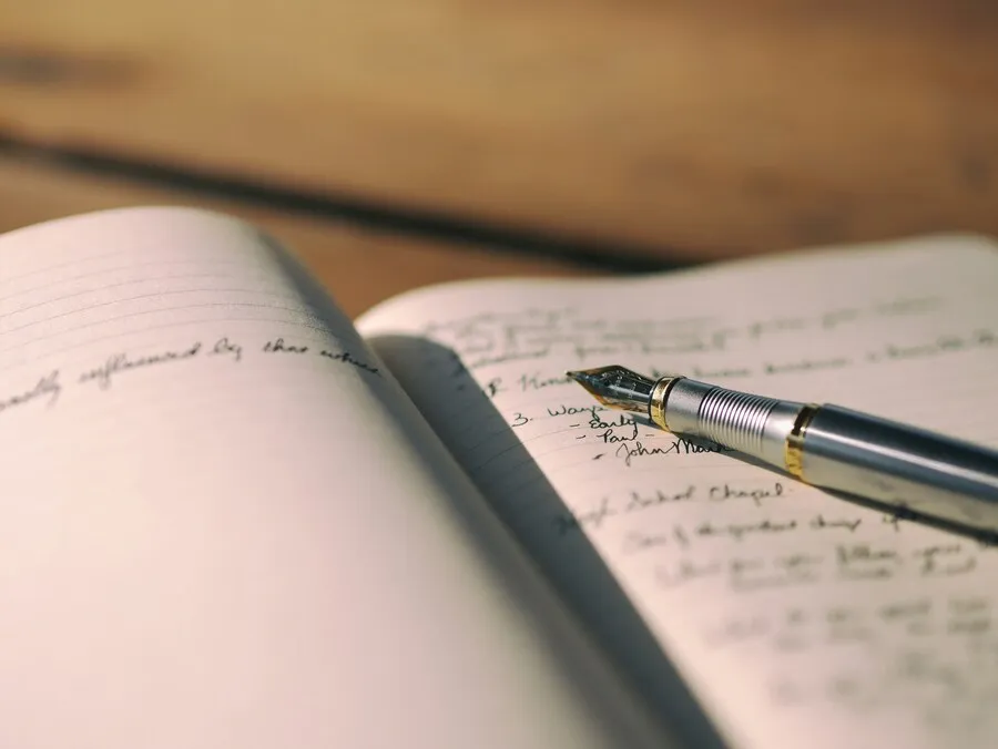 An image of a journal with some hand writing on it